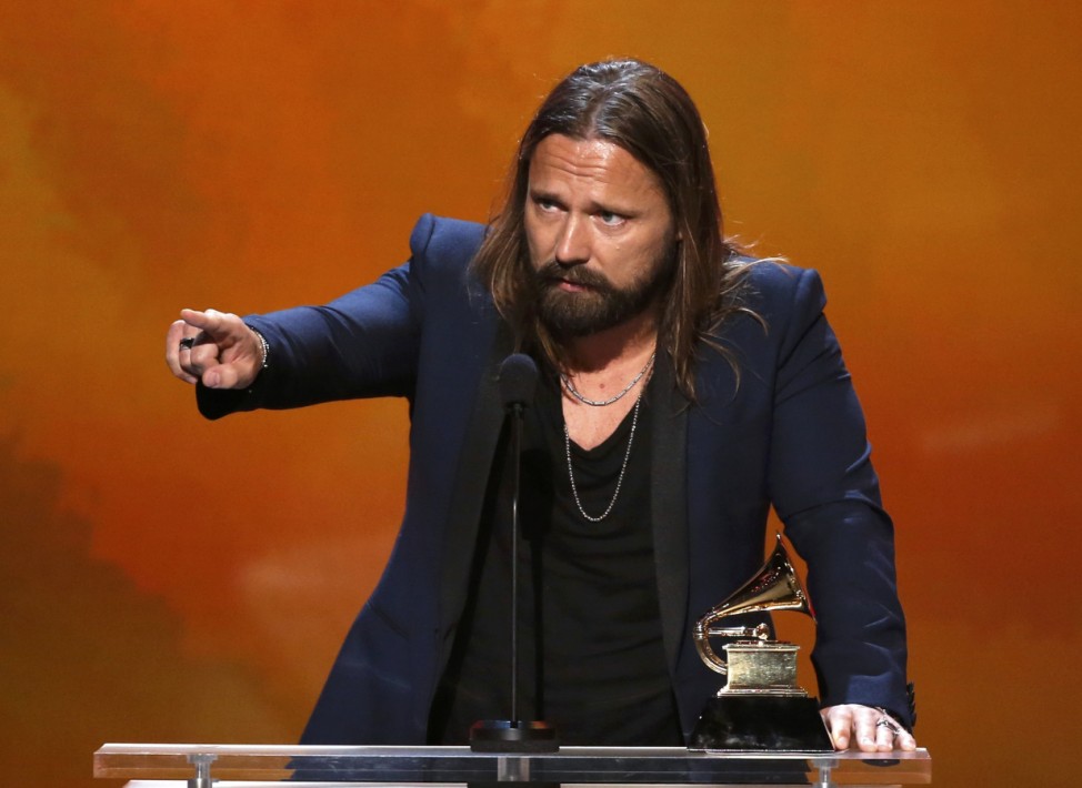 Max Martin accepts the award for Producer of the Year, Non-classical, during the pre-telecast awards at the 57th annual Grammy Awards in Los Angeles