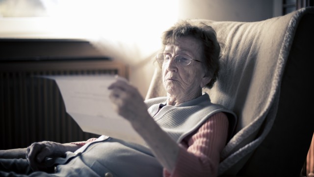 Senior woman reading a letter