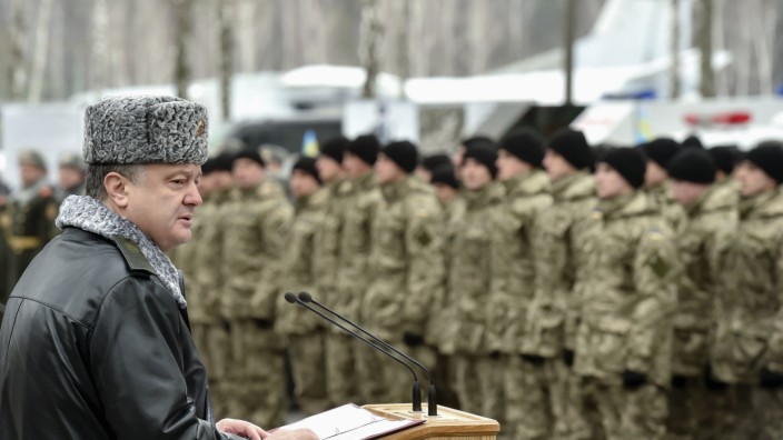 Handout picture of Poroshenko delivering a speech during his visit to the training center of the Ukrainian National Guard outside Kiev