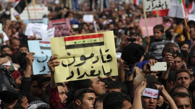 Iraqi Sunni Muslims take part in an anti-government demonstration in Ramadi