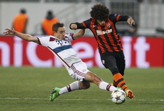 Shakhtar Donetsk's Taison fights for the ball with Bayern Munich's Rafinha during their Champions League round of 16 first leg soccer match in Lviv