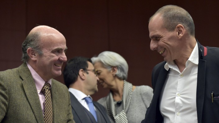 Spain's Finance Minister De Guindos chats with Greece Finance Minister Varoufakis during an extraordinary euro zone Finance Ministers meeting to discuss Athens' plans to reverse austerity measures agreed as part of its bailout, in Brussels