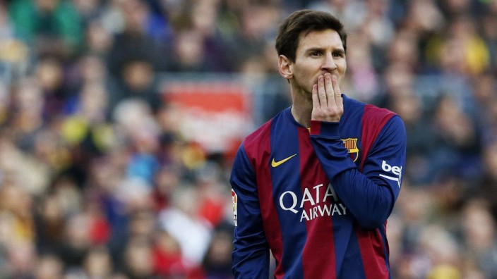 Barcelona's Messi gestures during the Spanish First division soccer match against Malaga at Camp Nou stadium in Barcelona