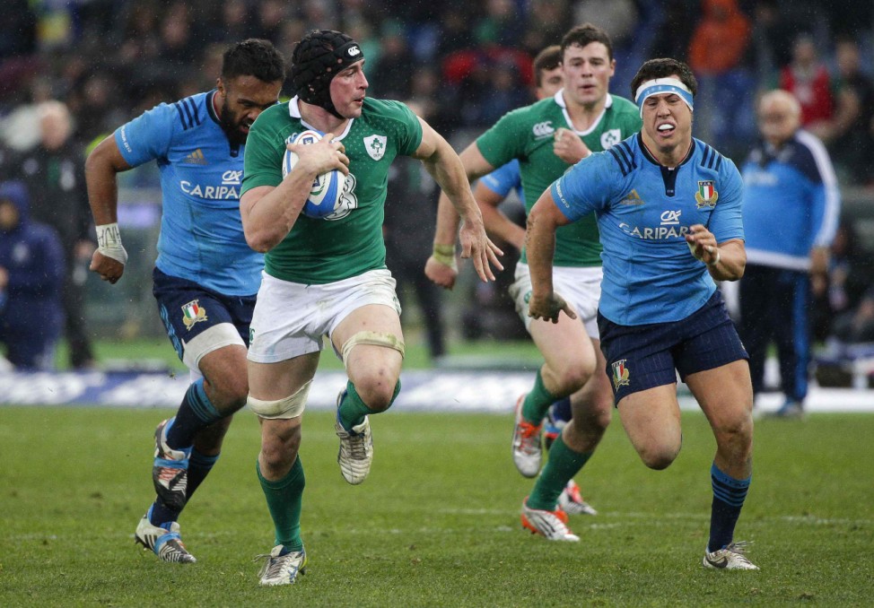 Ireland's O'Brien runs to score a try during their Six Nations Rugby Union match against Italy at the Olympic stadium in Rome