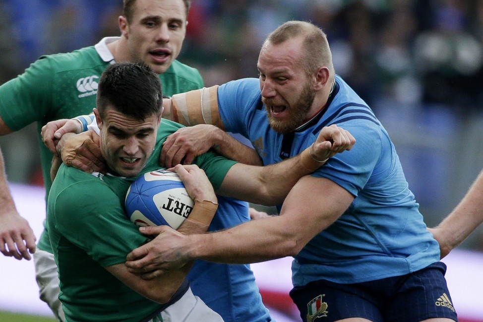 Ireland's Murray is tackled by Italy's Ghiraldini during their Six Nations Rugby Union match at the Olympic stadium in Rome