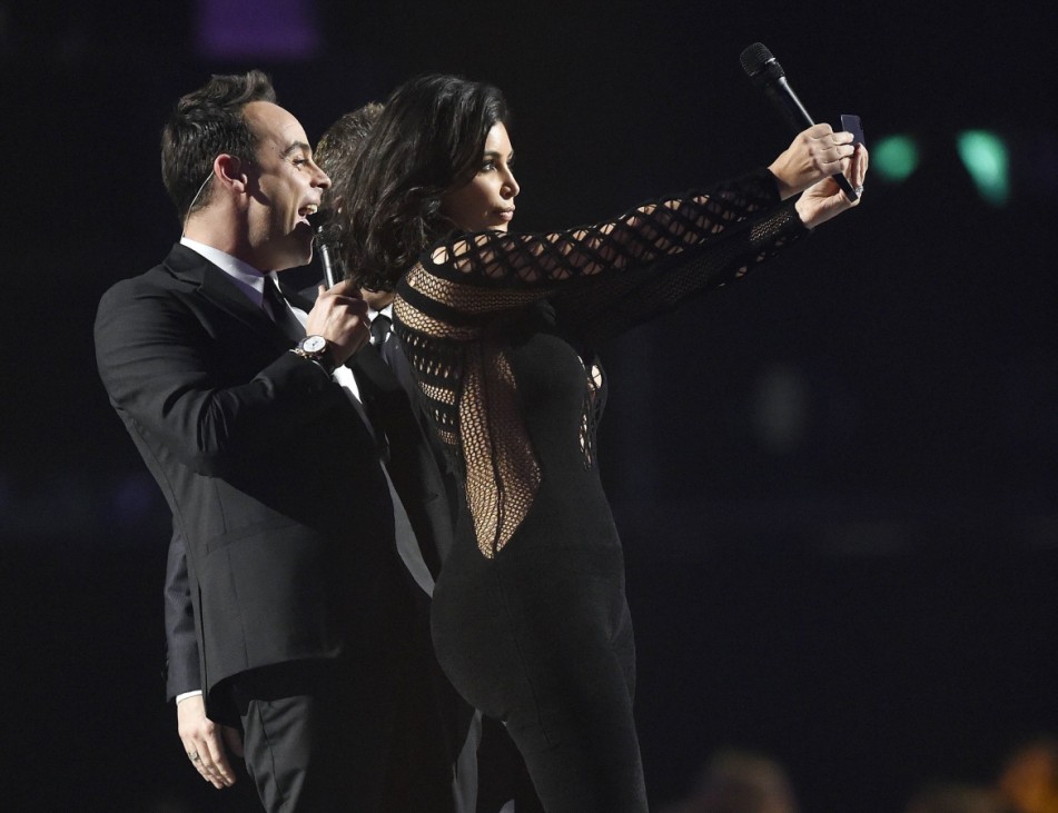 Kim Kardashian poses for a selfie with presenters Ant and Dec at the O2 Arena in London