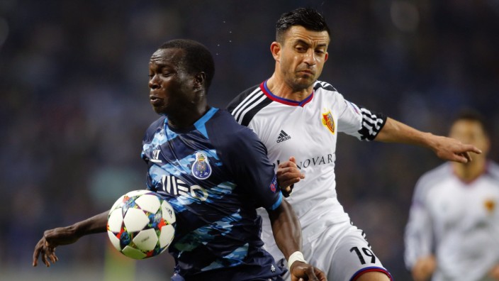 Porto's Aboubakar battles for the ball with FC Basel's Safari during their Champions League round of 16 second leg match in Porto