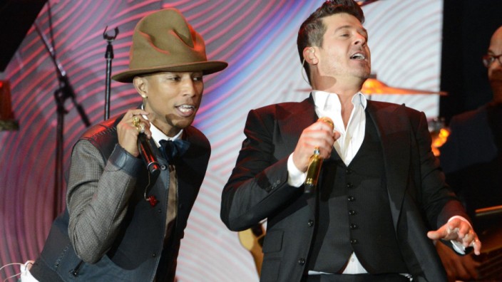 File photo of Pharrell Williams, Robin Thicke and T.I. performing at the Clive Davis Pre-Grammy Gala and Salute to Industry Icons, honoring Universal Music Group Chairman and CEO Lucian Grainge, in Beverly Hills