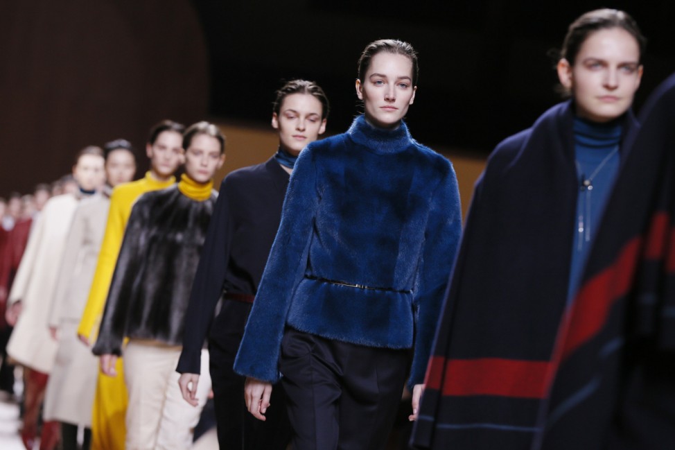 Models present creations by French designer Nadege Vanhee-Cybulski as part of her Autumn/Winter 2015/2016 women's ready-to-wear collection for fashion house Hermes during Paris Fashion Week