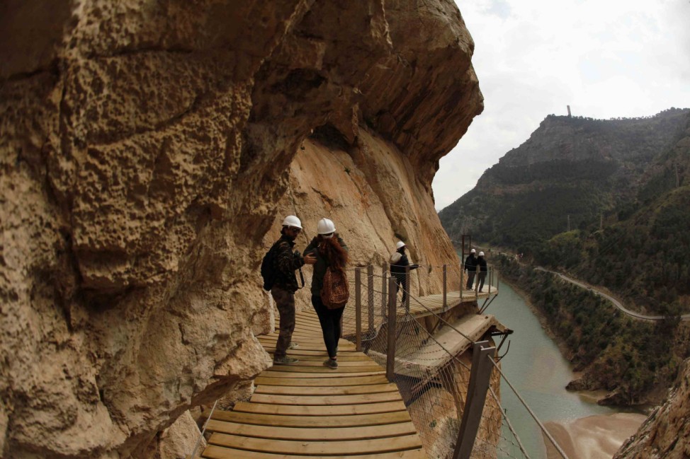 Journalists walk along the new Caminito del Rey (The King's little pathway) in El Chorro-Alora