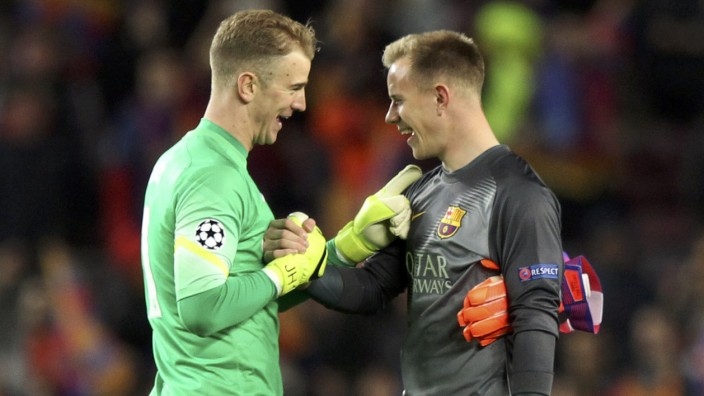Barcelona's goalkeeper ter Stegen and Manchester City's goalkeeper Hart talk at the end of during their Champions League round of 16 second leg soccer match in Barcelona