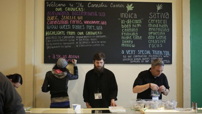 Employees make last-minute preparations before the grand opening of The Cannabis Corner in North Bonneville