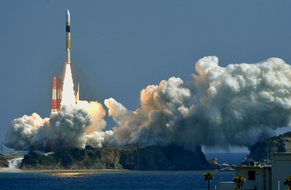 A H-IIA rocket, carrying a information gathering satellite, lifts off from the launching pad at Tanegashima Space Center on the Japanese southwestern island of Tanegashima
