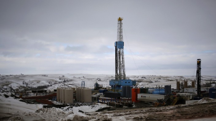 File photo of an oil derrick is seen at a fracking site for extracting oil outside of Williston