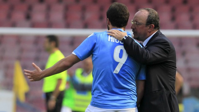 Napoli's coach Rafael Benitez talks to Gonzalo Higuain during the Italian Serie A soccer match against Fiorentina at San Paolo stadium in Naples