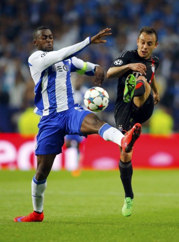 Bayern Munich's Rafinha and Porto's Martinez fight for the ball during their Champions League quarterfinal first leg soccer match in Porto