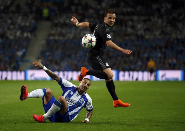Bayern Munich's Goetze and Porto's Quaresma fight for the ball during their Champions League quarterfinal first leg soccer match in Porto