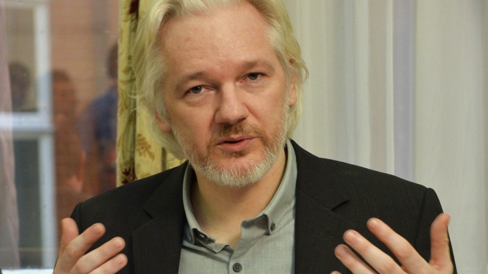 WikiLeaks founder Julian Assange gestures during a news conference at the Ecuadorian embassy in central London