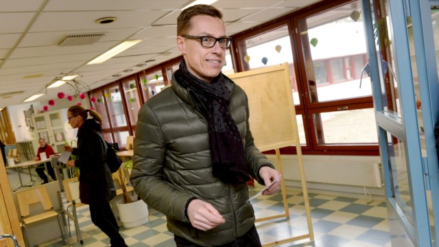 Finnish Prime Minister and leader of National Coalition Party Alexander Stubb casts his vote during the parliamentary election in Espoo