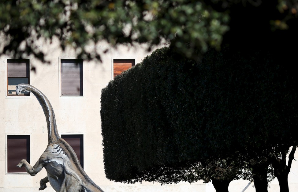 A scale model of a dinosaur is displayed in front of La Sapienza University headquarters in Rome; Dinosaurs