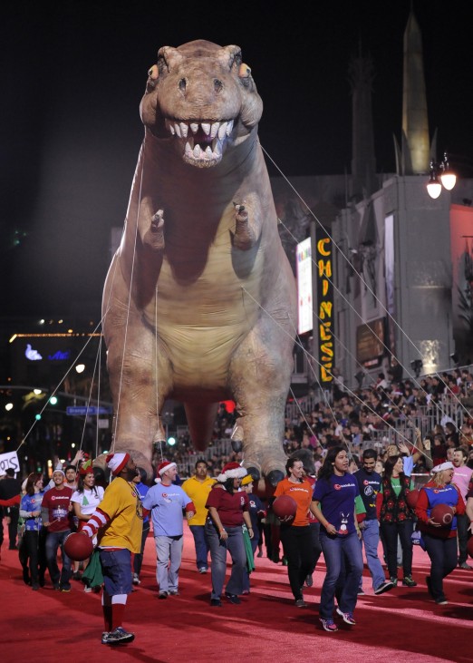 A dinosaur balloon makes its way down Hollywood Boulevard during the 82nd Annual Hollywood Christmas Parade in Los Angeles; Dinosaurs