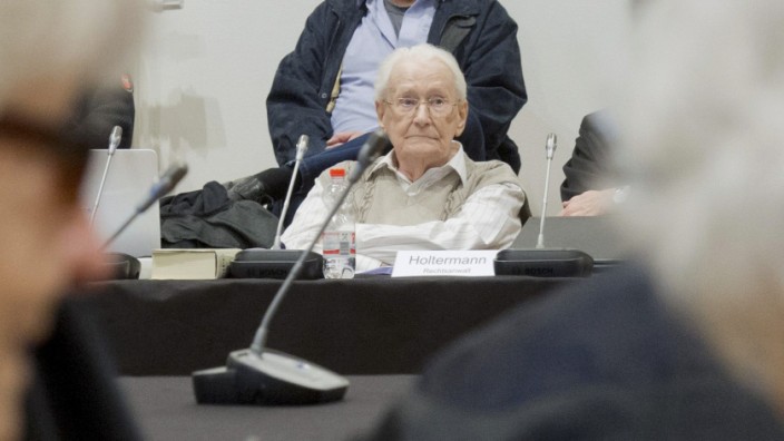 Former bookkeeper at Auschwitz Groening waits for start of his trial in Lueneburg
