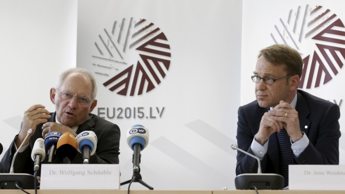 German Bundesbank President Weidmann listens as German Minister of Finance Schauble speaks at a news conference at the end of an informal meeting of Ministers for Economic and Financial Affairs (ECOFIN) in Riga