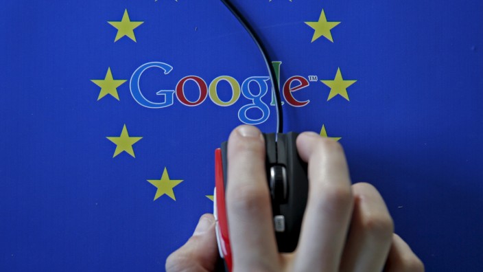 A woman hovers a mouse over the Google and European Union logos in Sarajevo