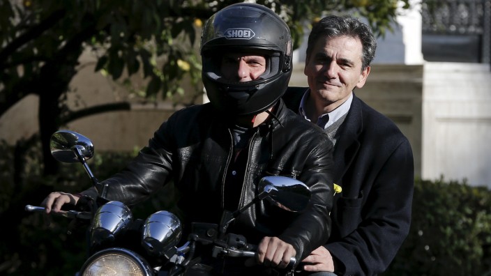 Greek Finance Minister Varoufakis and deputy minister for international economic relations Tsakalotos leave the Maximos Mansion after a meeting with PM Tsipras in Athens