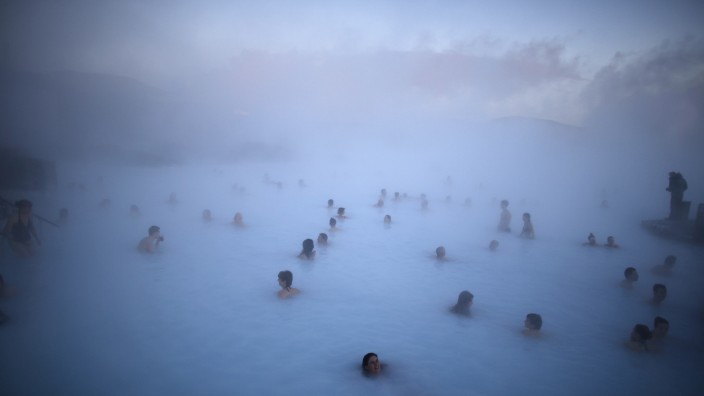 File photo of people relaxing in one of the Blue Lagoon hot springs near the town of Grindavik