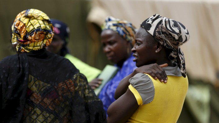 Women gather at a camp for Internally Displaced People as more women and children rescued from Sambisa arrive in the camp in Yola, Nigeria