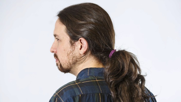 Pablo Iglesias, leader of Spain's Podemos (We Can) party, poses before an interview in Madrid