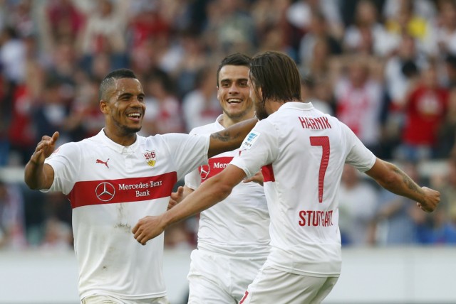 VfB Stuttgart's Didavi celebrates with Kostic and Harnik after scoring against FSV Mainz 05 in Bundesliga soccer match in Stuttgart