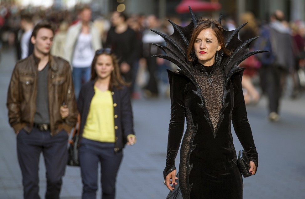 Participant of the Wave and Goth festival walks through the downtown pedestrian zone in Leipzig