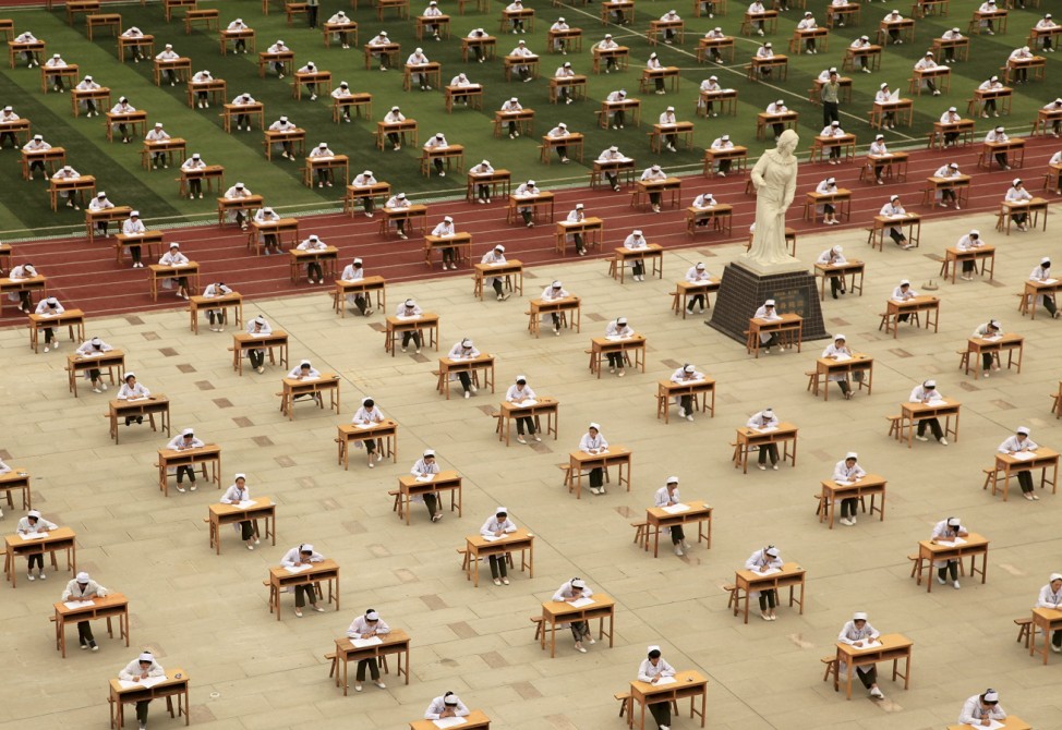 Hundreds of students of the school of nursing take part in an open-air examination at a playground of an vocational college in Baoji