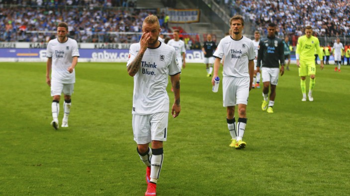 Adlung and his team mates of TSV 1860 Munich leave the pitch after their German second division Bundesliga soccer match against Karlsruhe SC in Karlsruhe