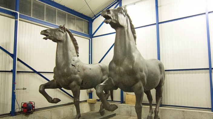 A police handout shows two recovered bronze sculptures made for Adolf Hitler's imposing Reich Chancellery that have been missing for years and are now stored in a police compound in the western German town of Bad Bergzabern