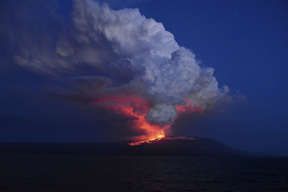 The Wolf volcano spews smoke and lava on Isabela Island, in this May 25, 2015 handout photograph provided by the Galapagos National Park