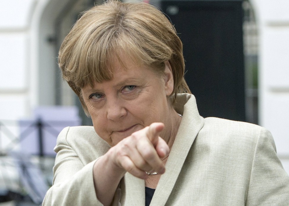 German Chancellor Merkel gestures during her visit to the Roentgen school in Berlin