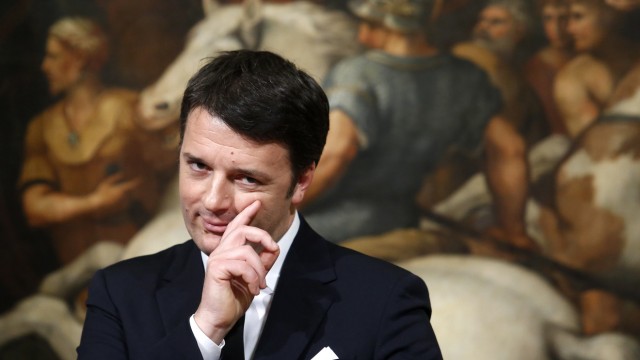 Italian Prime Minister Renzi gestures during a news conference with his Greek counterpart Tsipras at Chigi palace in Rome