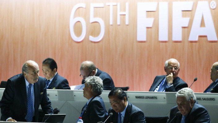 FIFA President Blatter speaks with FIFA Vice-President Maria Villar Llona of Spain at the 65th FIFA Congress in Zurich