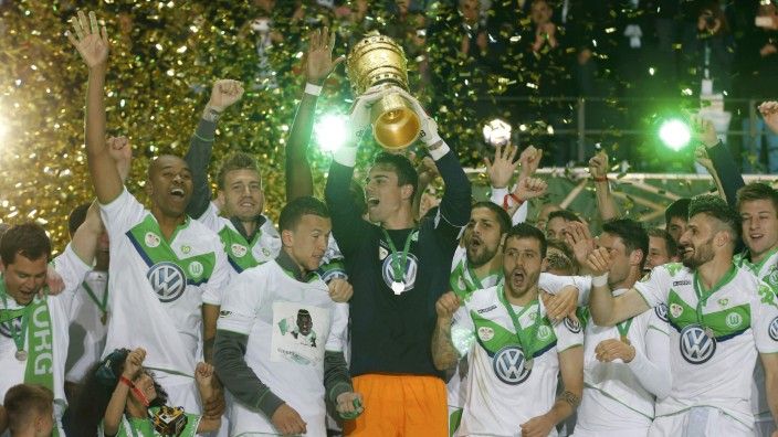 VfL Wolfsburg's goalkeeper Benaglio lifts up the trophy after their German Cup (DFB Pokal) final soccer match against Borussia Dortmund in Berlin