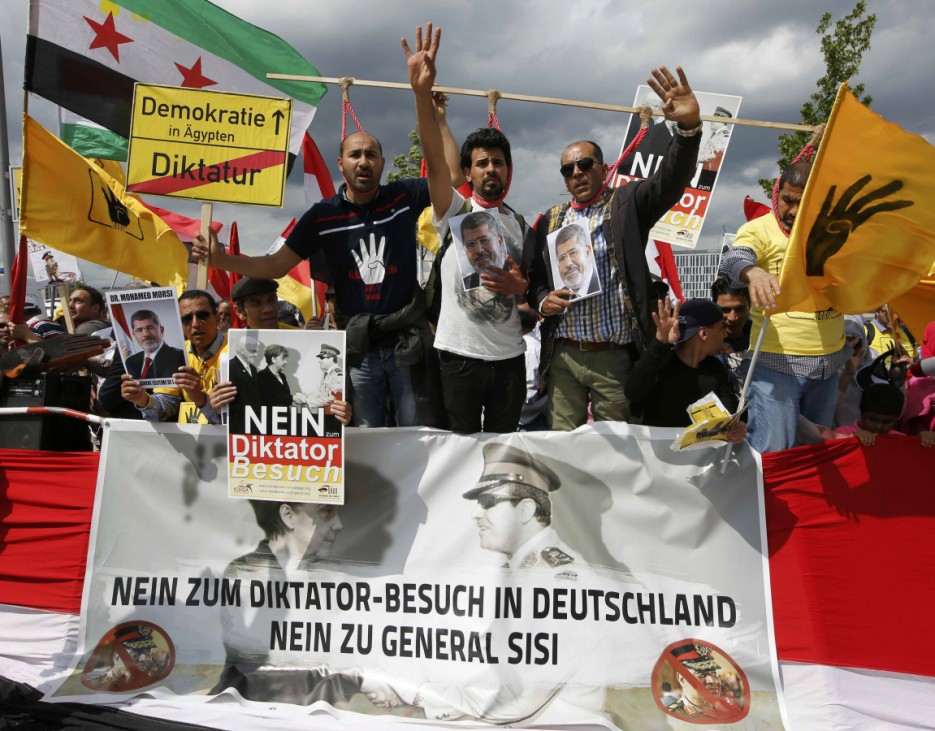 Demonstrators protest against Egypt's President Sisi opposite the Chancellery in Berlin