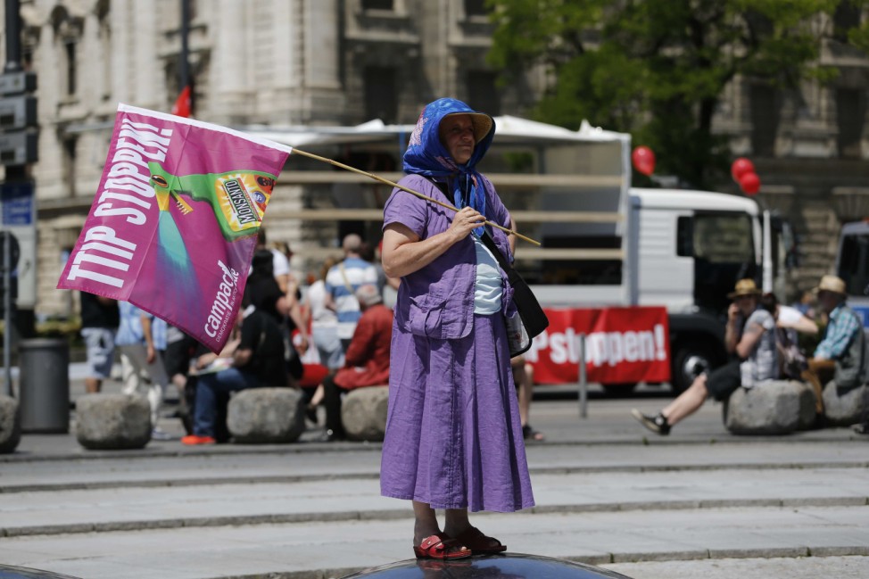 Woman demonstrates against TTIP during protest rally prior to the G7 summit in Munich