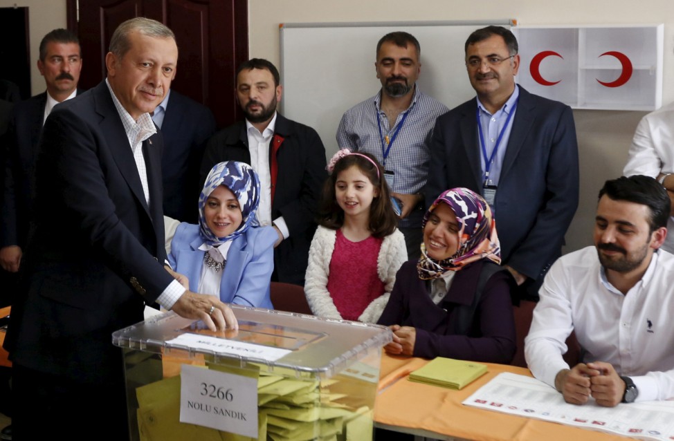 Turkish President Tayyip Erdogan casts his ballot at a polling station during the parliamentary election in Istanbul, Turkey