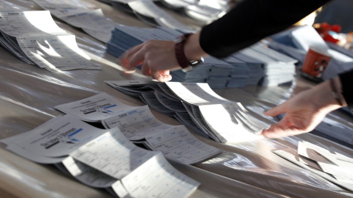 Electoral official sorts ballot papers in Munich