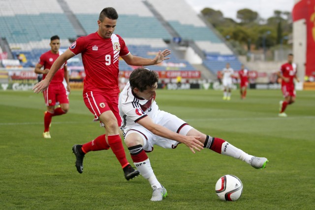 Germany's Sebastian Rudy tries to control the ball next to Gibraltar's Kyle Casciaro during their Euro 2016 qualifying soccer match at Algarve stadium in Faro, Portugal