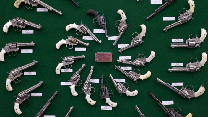 Factory engraved Colt revolvers are displayed at venue for NRA meeting, in Houston, Texas