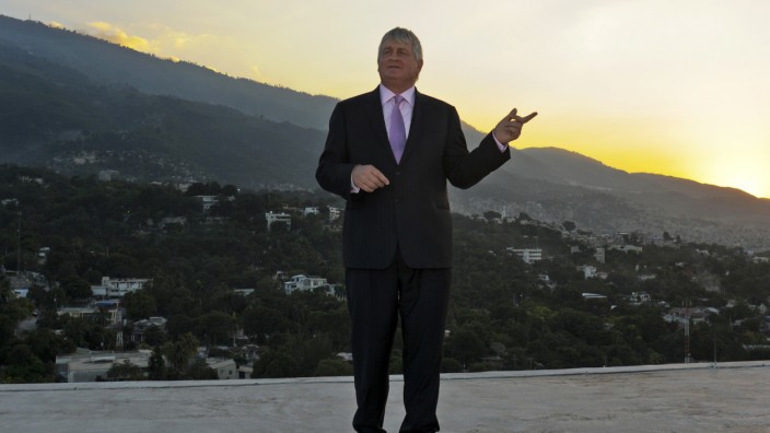 Digicel Chairman Denis O'Brien poses on the rooftop of his company's headquarters in Port-au-Prince