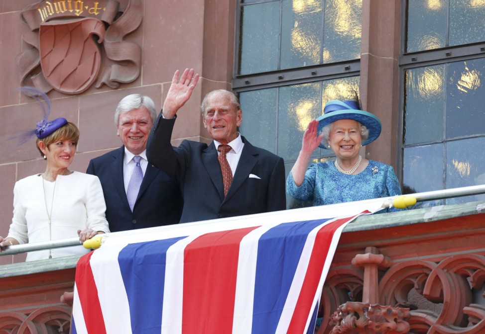 Britain's Queen Elizabeth and Prince Philip wave from the balcony of Roemer townhall in Frankfurt